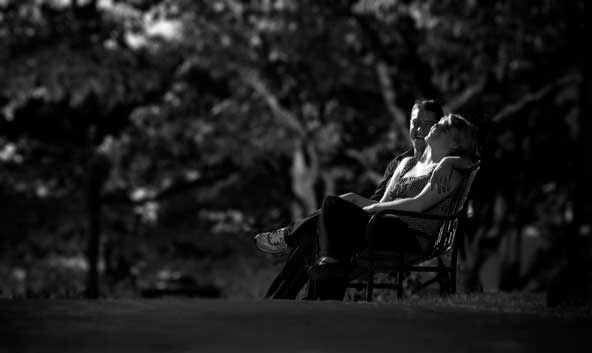 couple sitting on a bench in the park